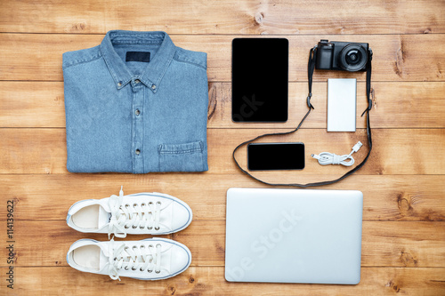 Travel concept shoes, shirt, mobile phone, laptop,mp3, usb, came