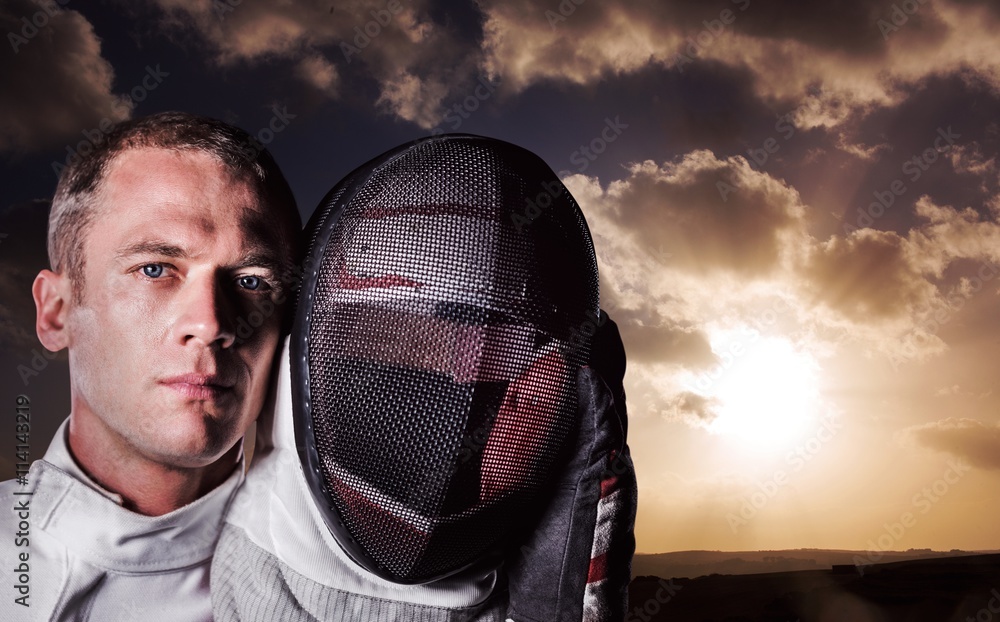 Φωτογραφία Composite image of close-up of swordsman holding fencing mask