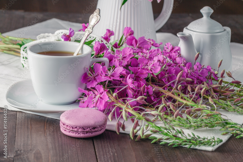 Fotografie Summer tea on wooden table with macaroon