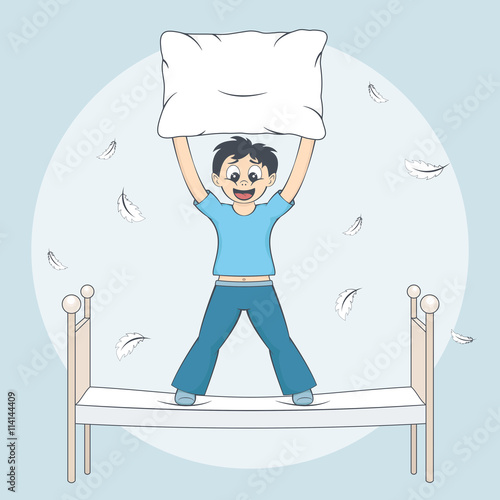 Boy starts pillow fight. Child with cushion on bed