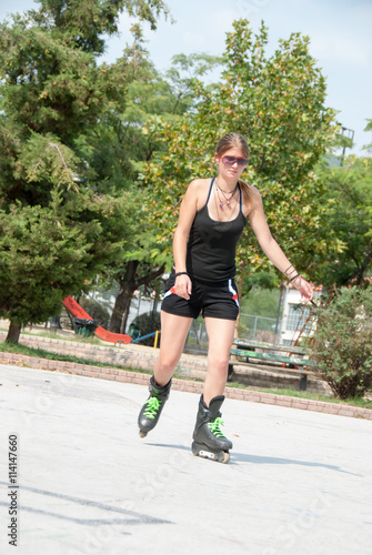 Teen skating outdoors in the park