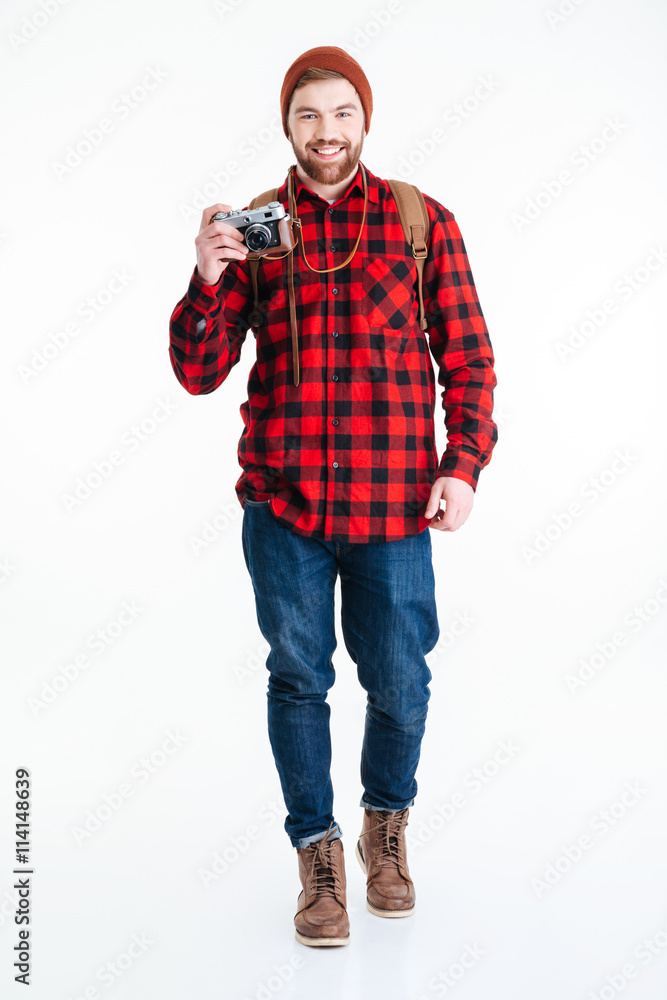 Smiling male tourist holding camera Smiling male tourist holding camera