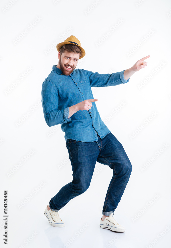 Cheerful young bearded man dancing over white background Cheerful young bearded man dancing over white background