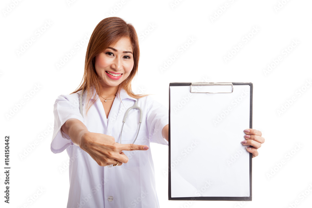 Young Asian female doctor point to a blank clipboard Young Asian female doctor point to a blank clipboard