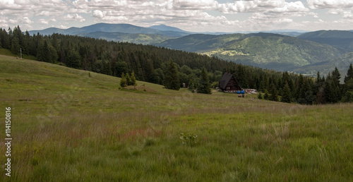 Hala Rycerzowa mountain meadow with Babia hora and other hills and mountain ranges in Beskid Zywiecki mountains