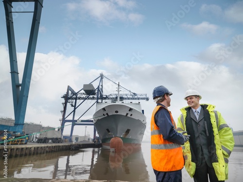 Businessman And Port Worker With Ship photo