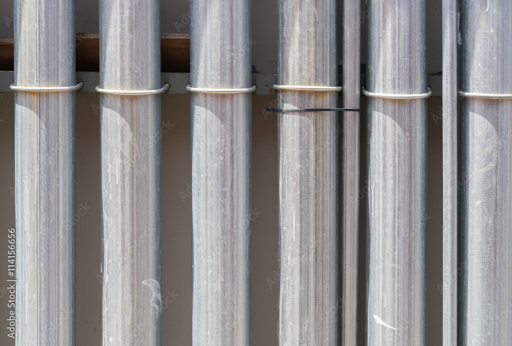 Metal pipe on in cement wall
Metal pipe on in cement wall