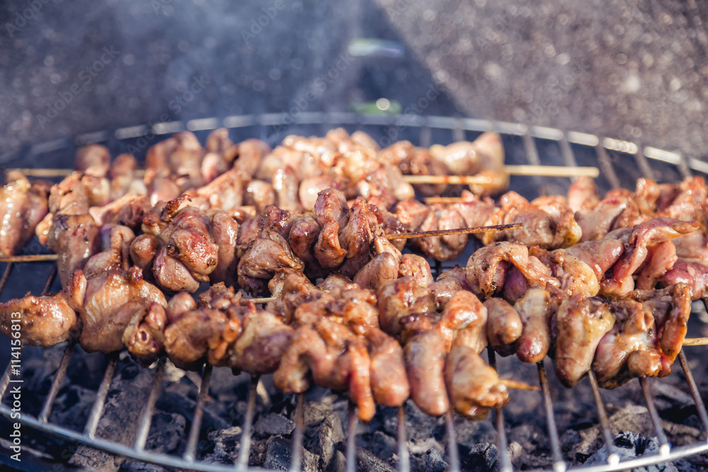 meat kebab skewers on the grill, chicken hearts,