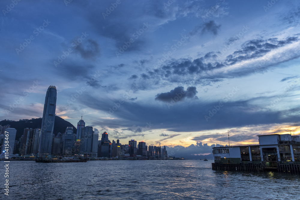 Naklejka premium Sunset over Victoria Habour in Hong Kong