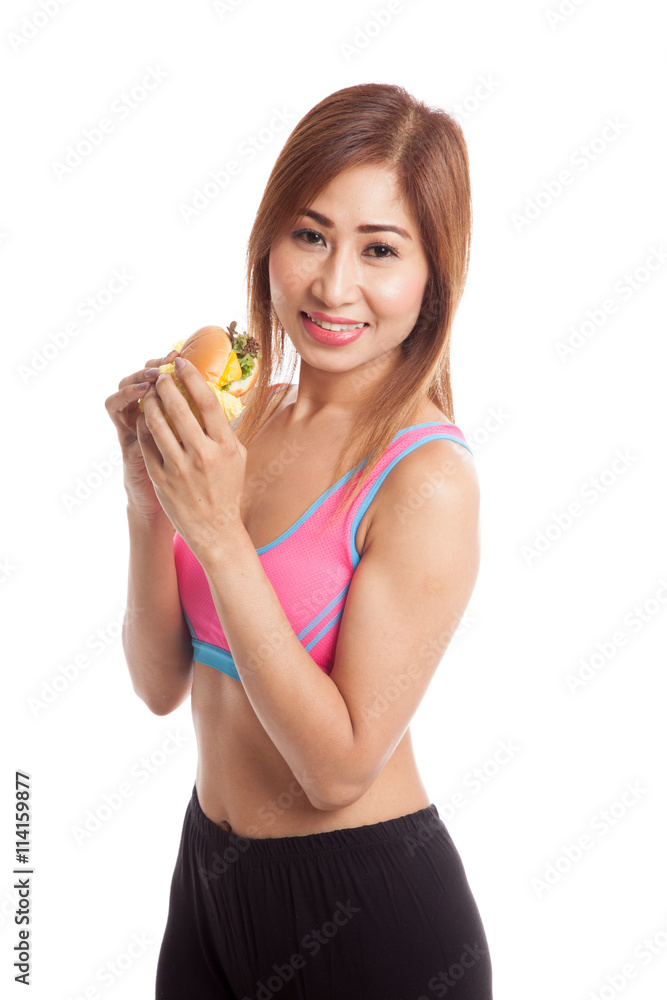 Beautiful Asian healthy girl enjoy eating hamburger Beautiful Asian healthy girl enjoy eating hamburger