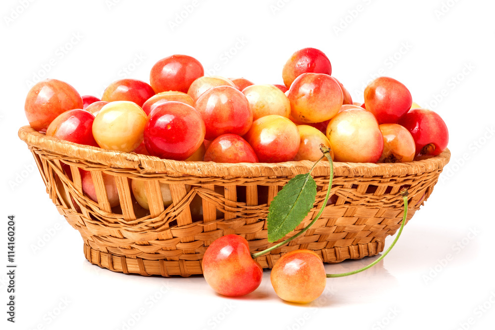 yellow cherries in a wicker basket isolated on white background yellow cherries in a wicker basket isolated on white background