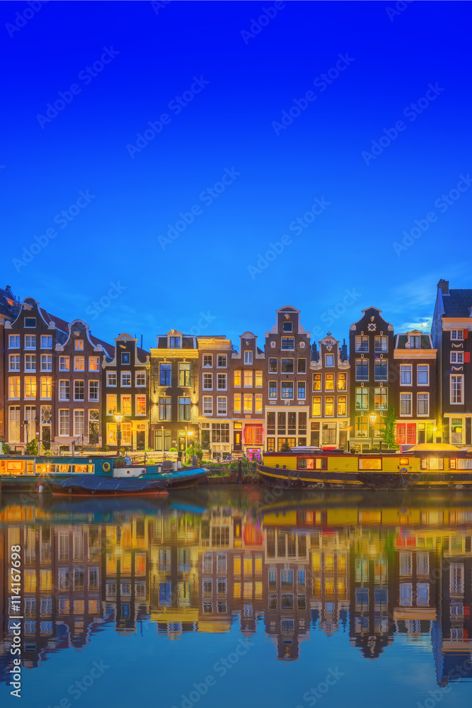 Fototapeta premium Amstel river, canals and night view of beautiful Amsterdam city. Netherlands