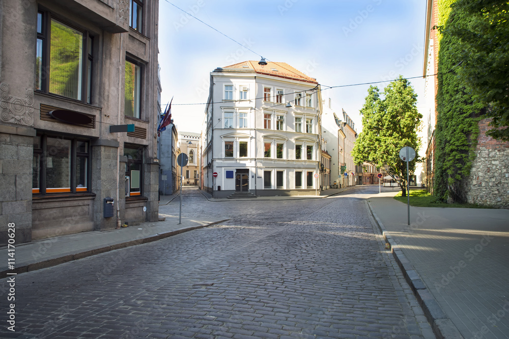 Empty streets of the old town of Riga pavers early summer morning