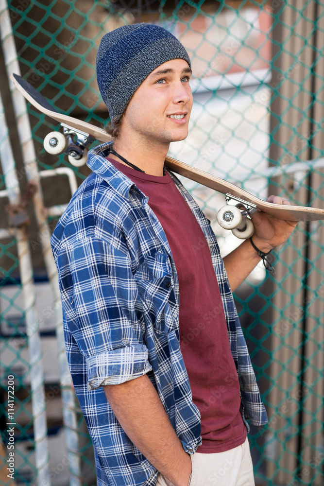Handsome guy with skateboard