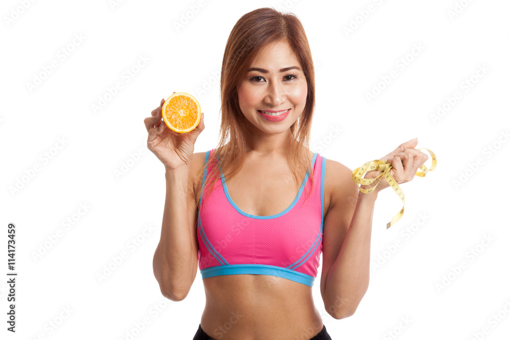 Asian healthy girl on diet with orange fruit and measuring tape Asian healthy girl on diet with orange fruit and measuring tape