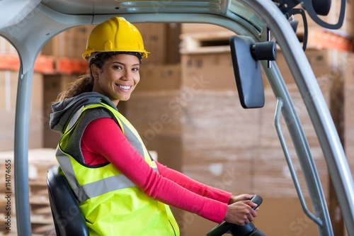 Portrait of smiling worker is posing during work