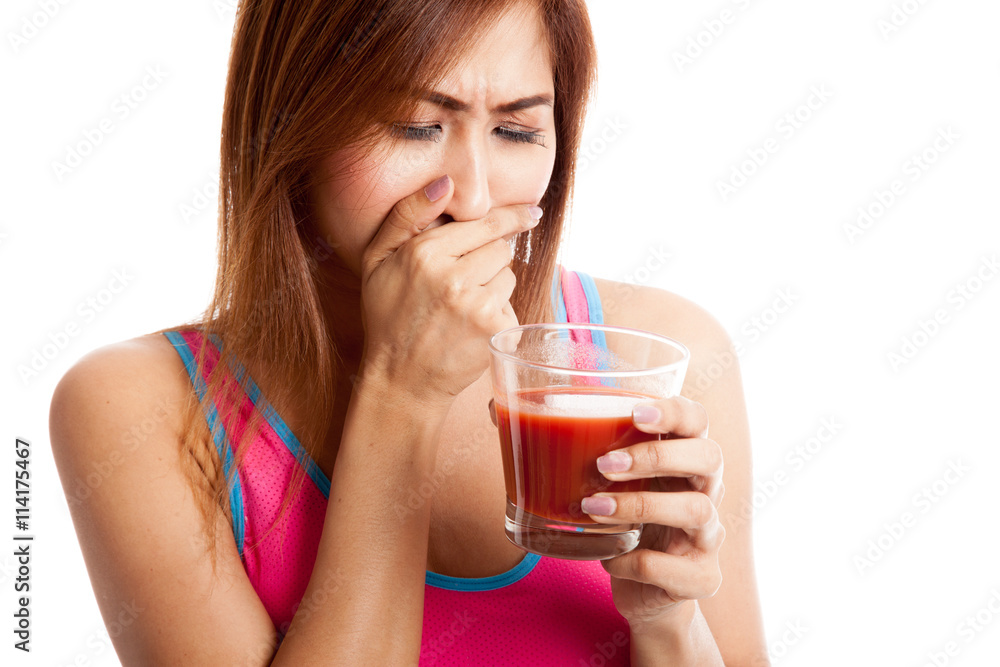 Beautiful healthy Asian girl hate tomato juice Beautiful healthy Asian girl hate tomato juice