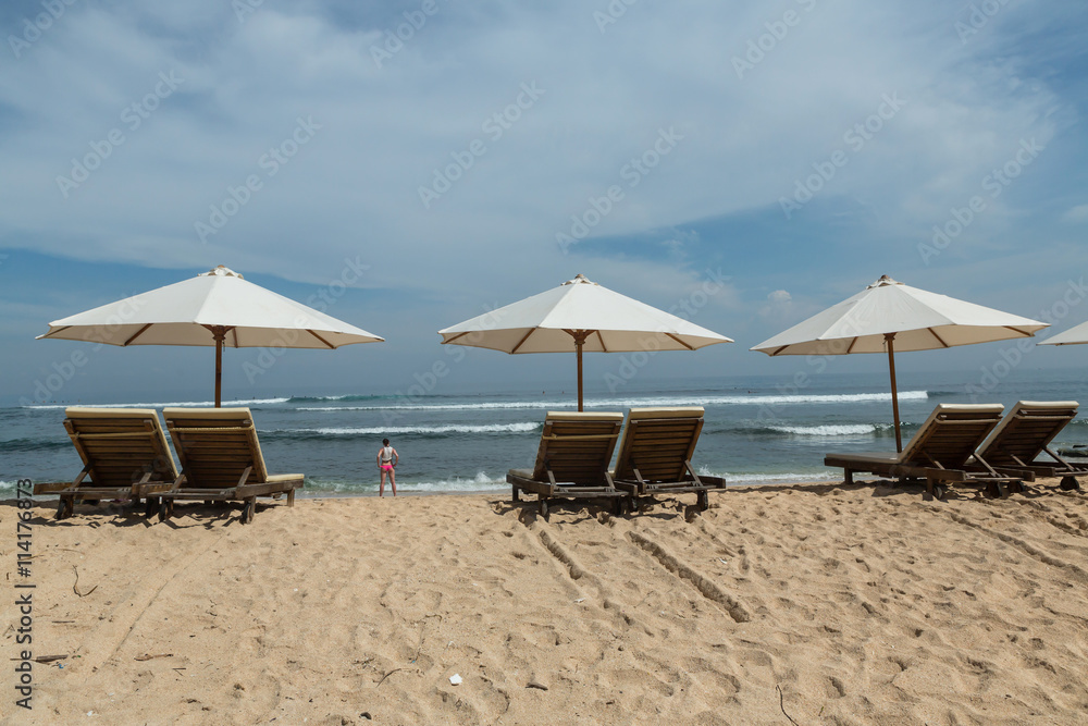 Balangan beach with parasol, Nusa Dua, is one of the most beautiful in Bali, it is called Mars at its bottom is covered with volcanic rock.