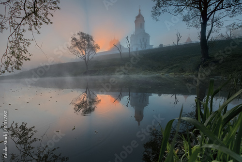 Canvas Print Russian orthodox monastery at sunrise.