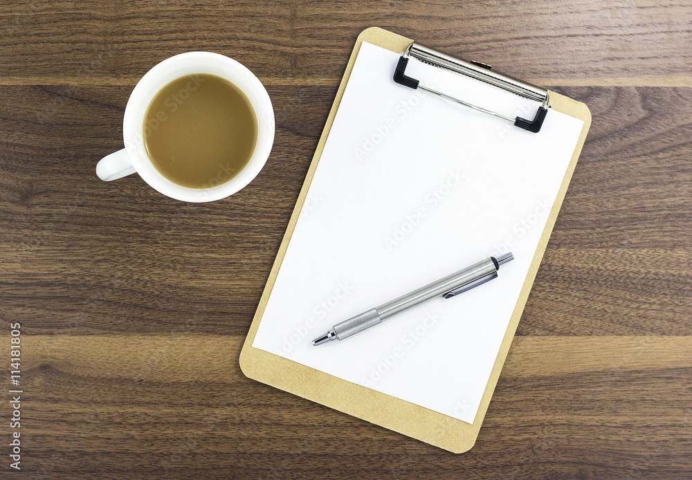 Blank Clipboard and a cup of coffee on wood Blank Clipboard and a cup of coffee on wood
