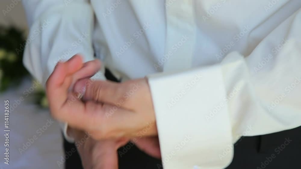 Close up of young man cufflinks boutonniere Close up of young man cufflinks boutonniere