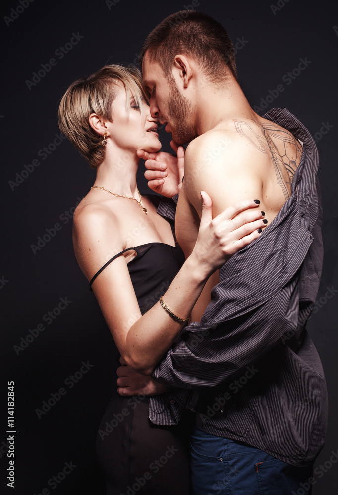 Hot and sexy young couple in love embracing and kissing. Hot and sexy young couple in love embracing and kissing.