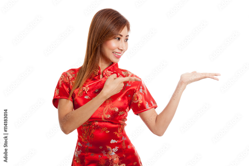Asian girl in chinese cheongsam dress point to blank space on h Asian girl in chinese cheongsam dress point to blank space on h