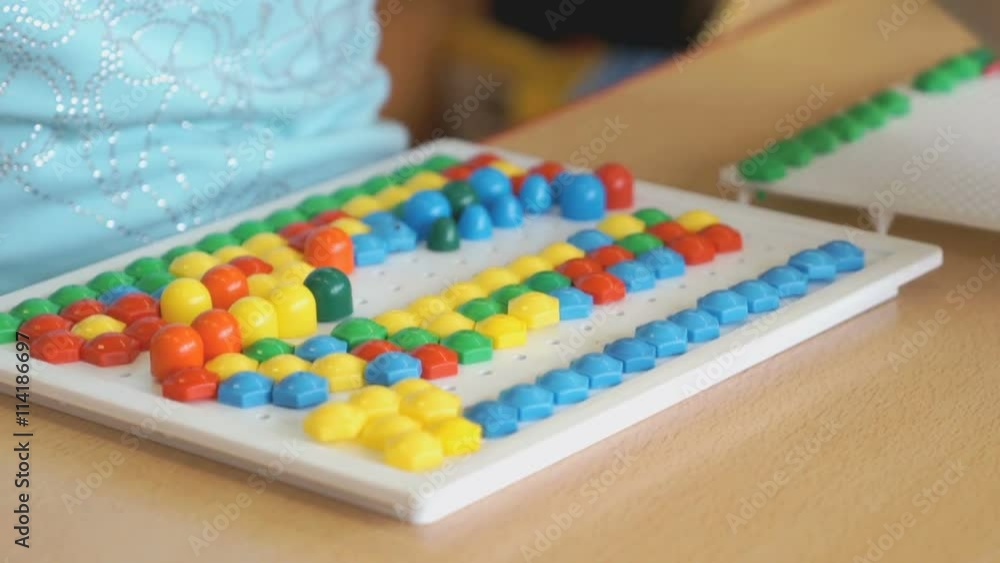 Little girl plays a intellectual educational game Little girl plays a intellectual educational game