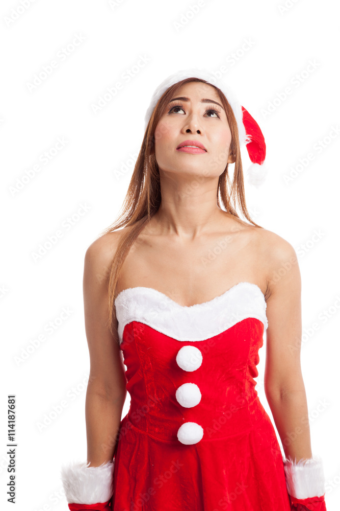 Asian Christmas girl with Santa Claus clothes look up Asian Christmas girl with Santa Claus clothes look up