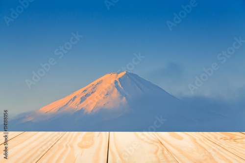 Wood table top on Fuji mountain background photo