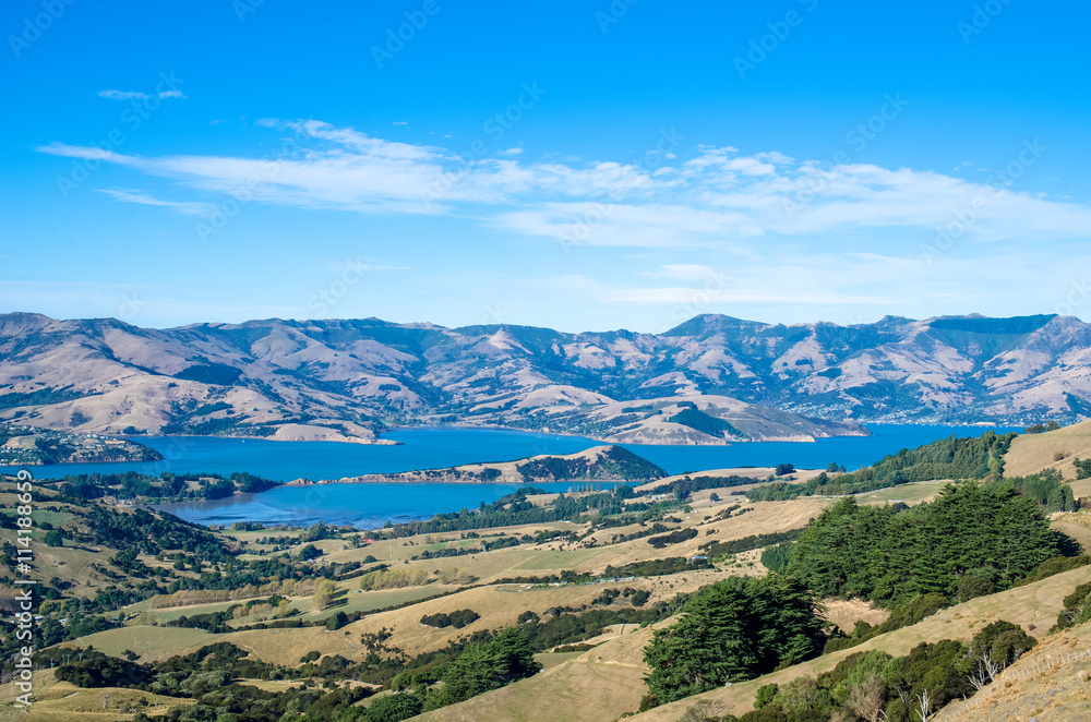 Akaroa harbour view from the hilltop in the heart of Bank Peninsula with an eroded volcanic landscape.