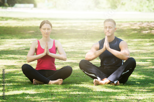Young Couple Practicing Yoga