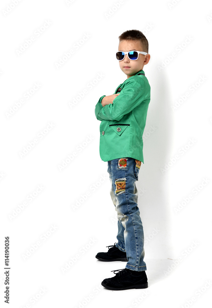 Fashion beautiful little boy in sunglasses blue cloth jeans stan Fashion beautiful little boy in sunglasses blue cloth jeans stan