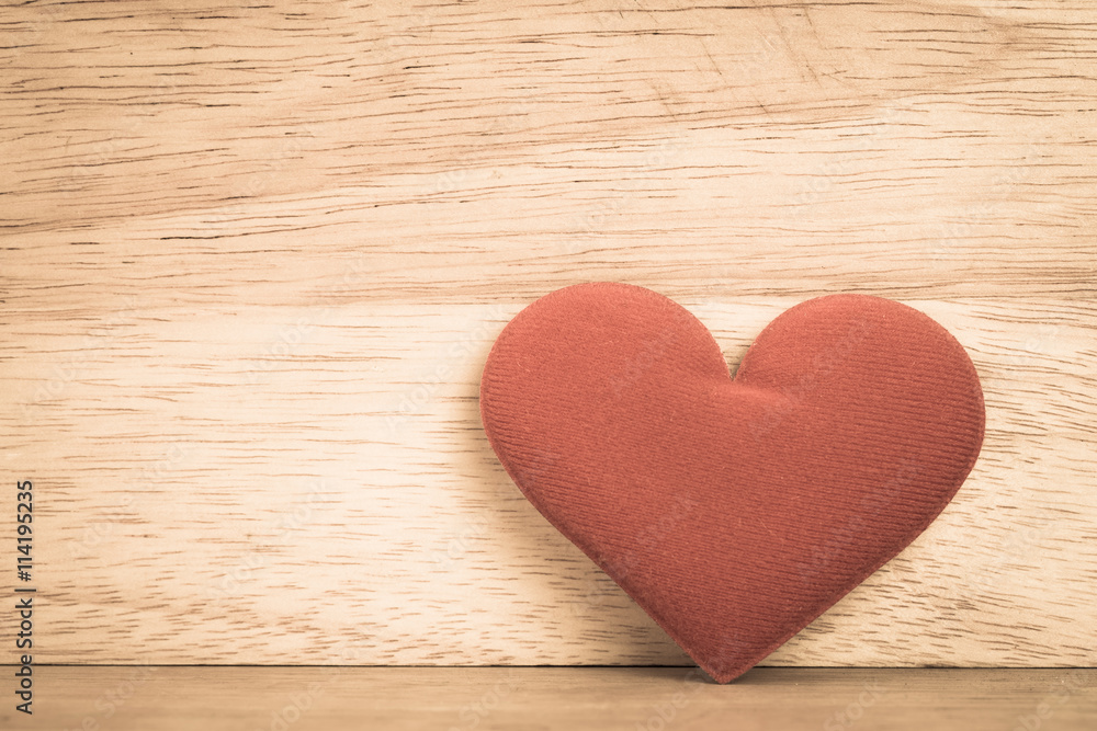 Valentine day background, red love heart on wooden background Valentine day background, red love heart on wooden background