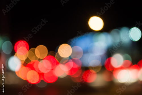 image of blur street bokeh with colorful lights in night time. © coffmancmu