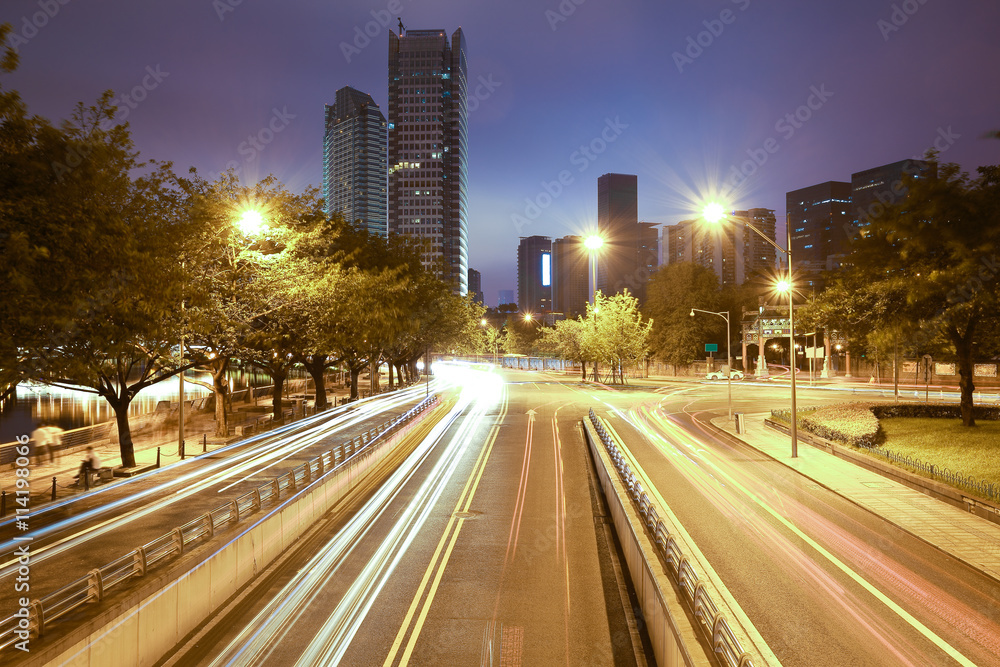 Road with city modern architecture background night