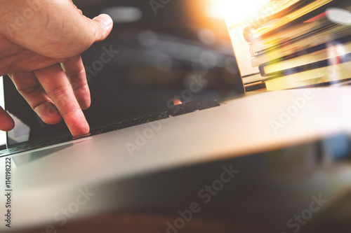 close up of business man hand working on blank screen laptop com