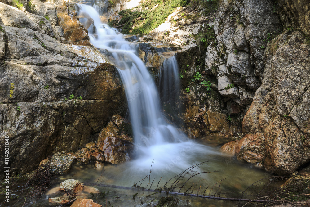 Waterfall over limestone rocks in the Carpathians Waterfall over limestone rocks in the Carpathians