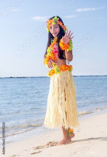 Hula Hawaii dancer dancing on the beach