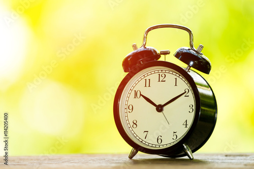 Alarm clock on wood table
