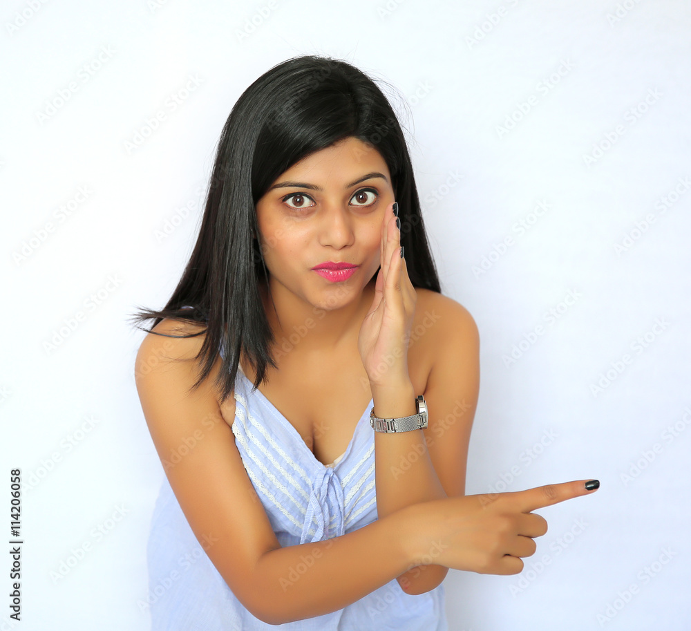 A young sexy Indian girl pointing her finger isolated on a white Stock  Photo | Adobe Stock