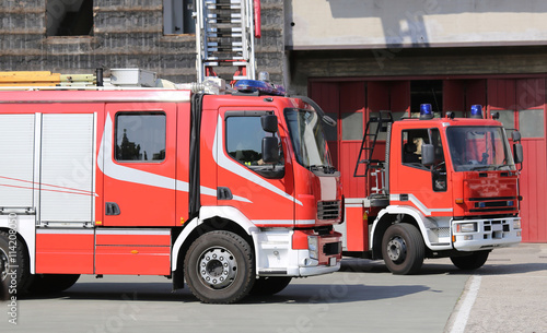 two red fire engine trucks during a fire drill