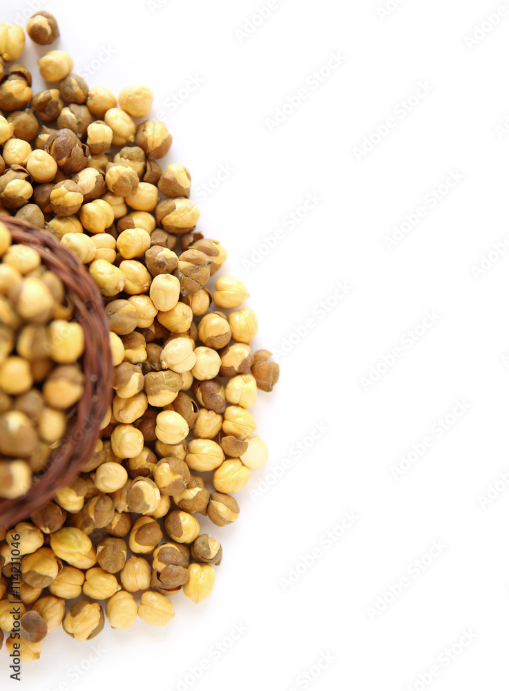 Chickpeas, in wooden basket, beans isolated on a white backgroun Chickpeas, in wooden basket, beans isolated on a white backgroun