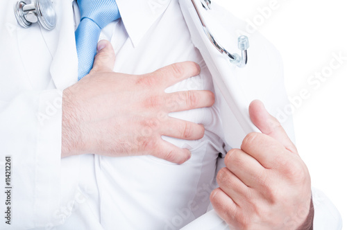 Close-up of medic or doctor grabbing chest like heart attack