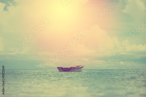 Lonely small boat in ocean