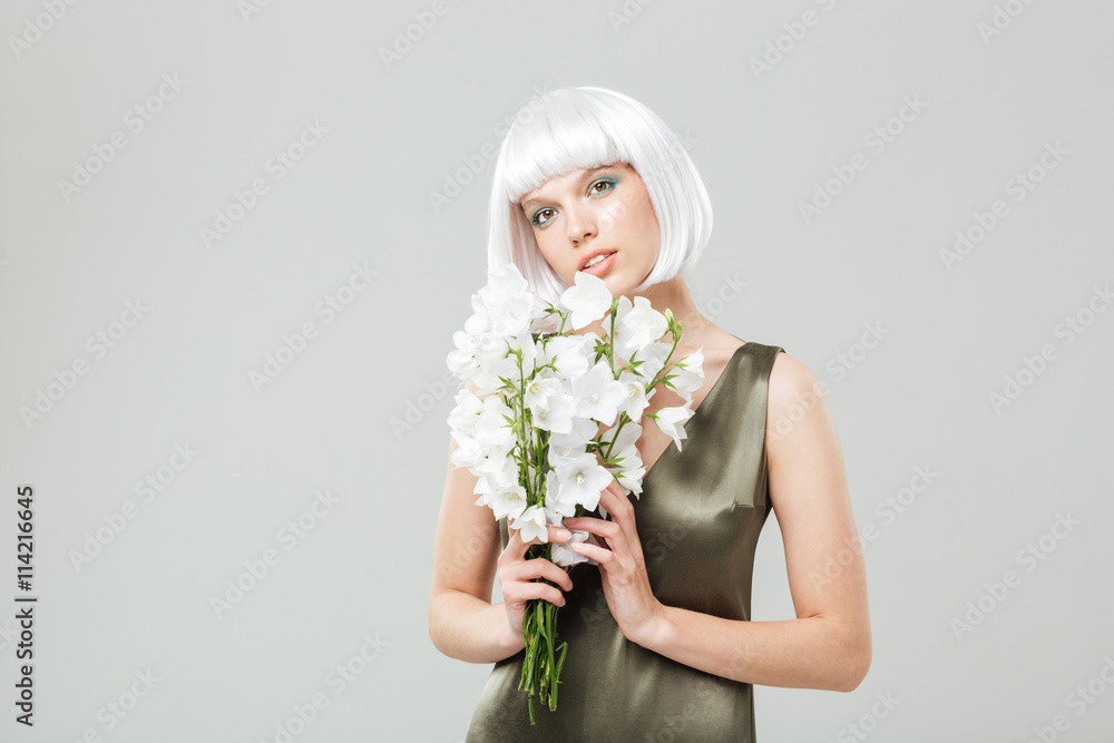 Sensual attractive young woman with bouquet of flowers Sensual attractive young woman with bouquet of flowers
