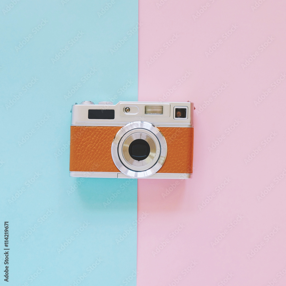 Vintage camera look on pink and blue background, minimal style