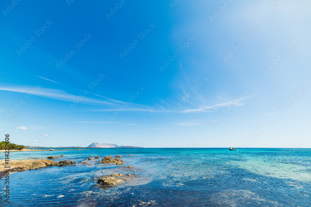 blue sky over cala d'ambra beach