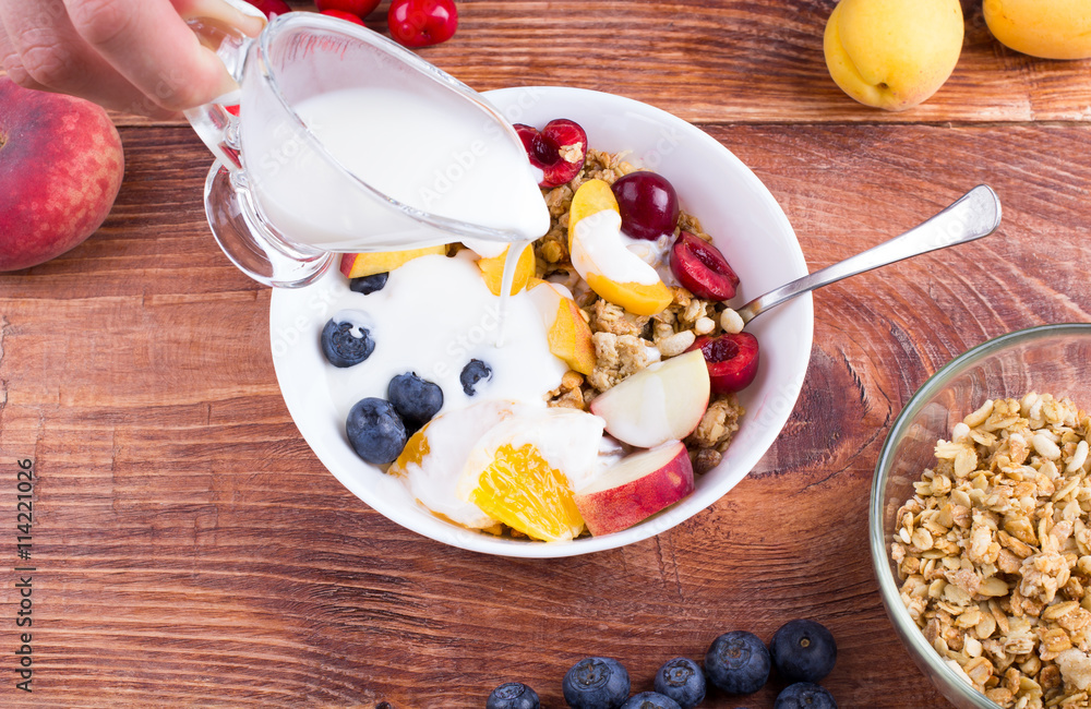 The person cooks fruit salad. The person cooks fruit salad.