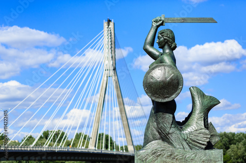 The mermaid statue on the Vistula river bank in Warsaw, Poland. Photo with shallow depth of field.